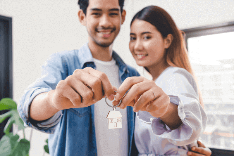 couple holding first house key